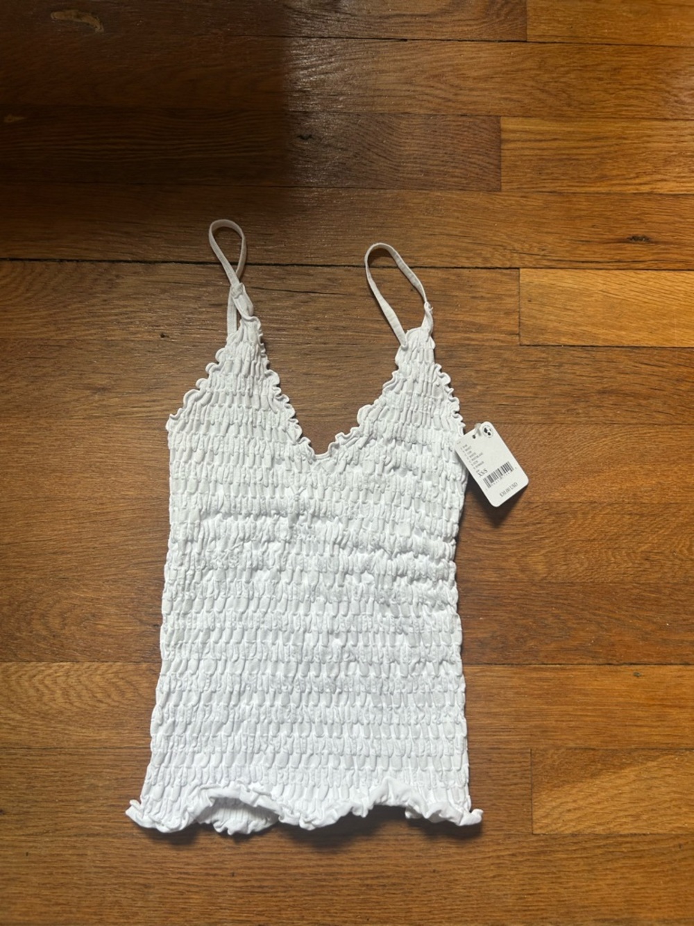 Free people white tank top. New with tags. XS/S